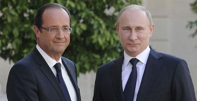 Oland sa Merkel i Putinom o Ukrajini Oland sa Merkel i Putinom o Ukrajini