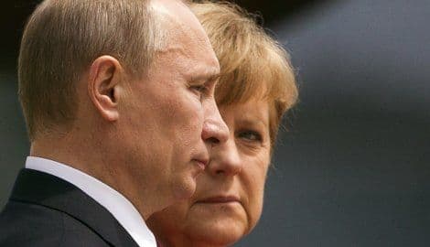 Oland, Merkel i Putin razgovarali o Ukrajini Oland, Merkel i Putin razgovarali o Ukrajini